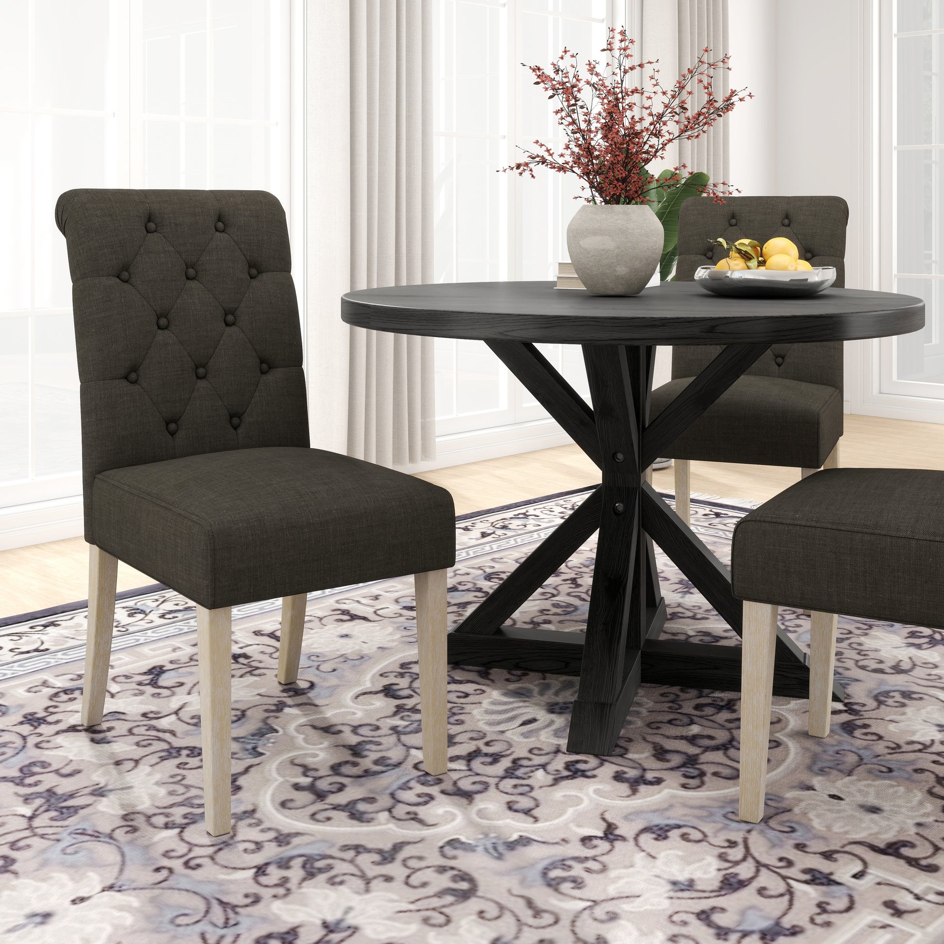 Dark grey tufted dining chair with light wood legs