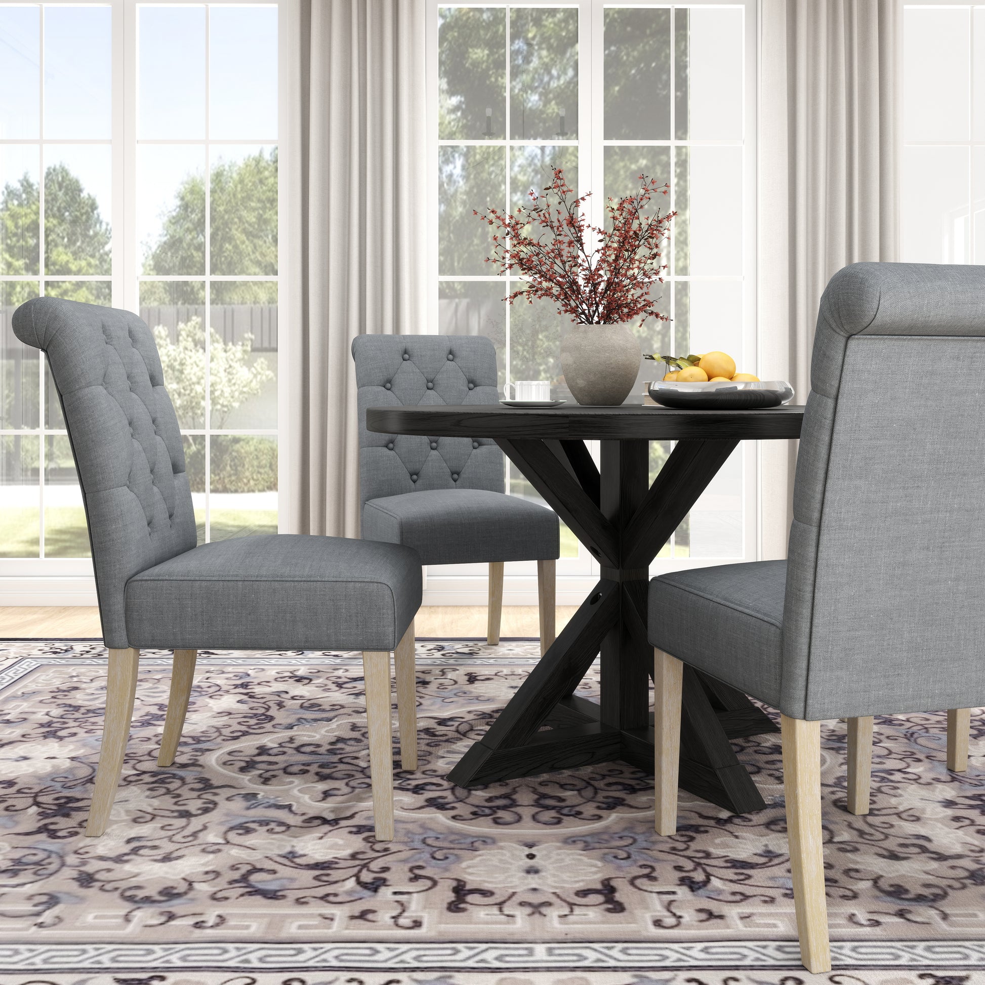 Grey fabric tufted dining chair with light wood legs