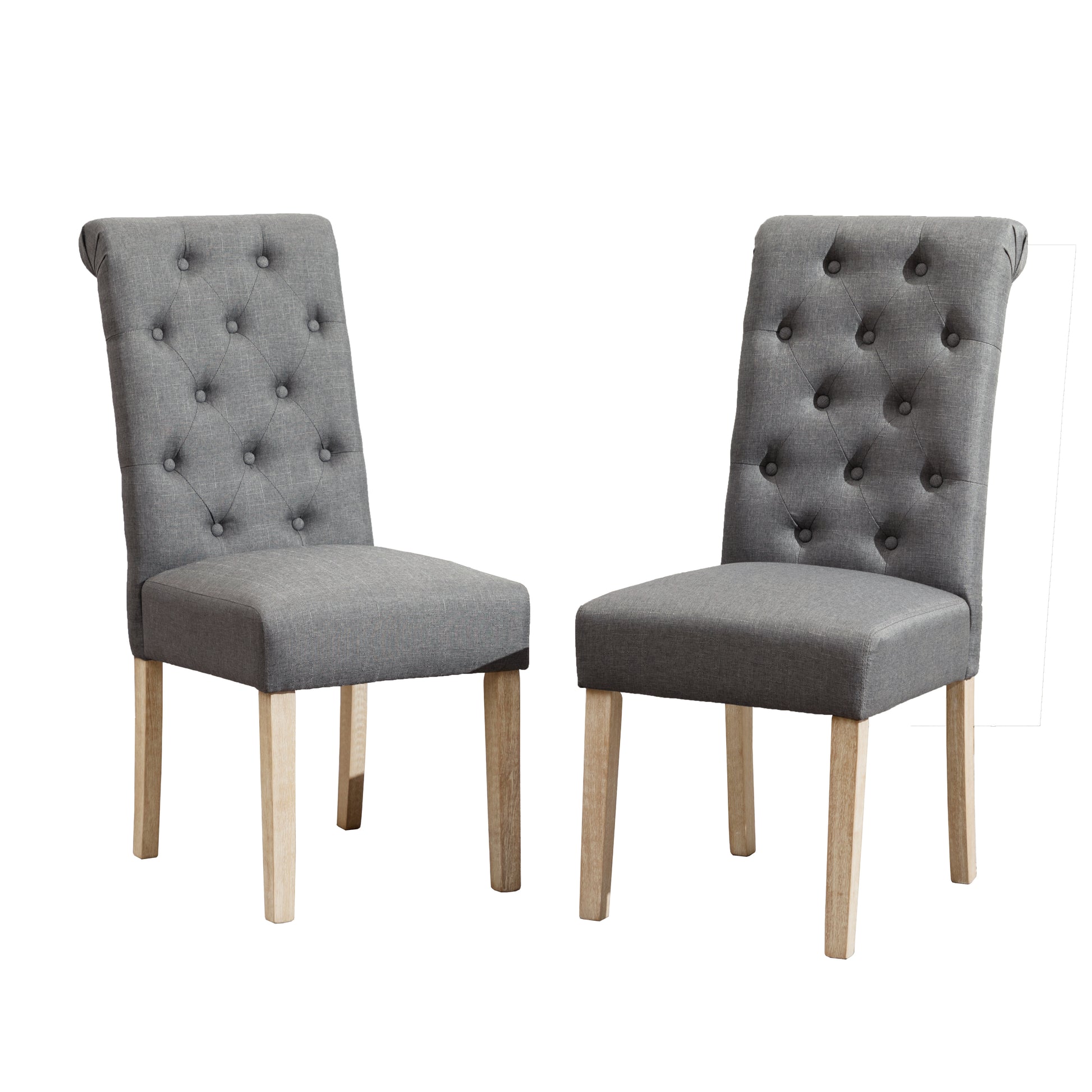 Two grey upholstered dining chairs with tufted backs and light wood legs