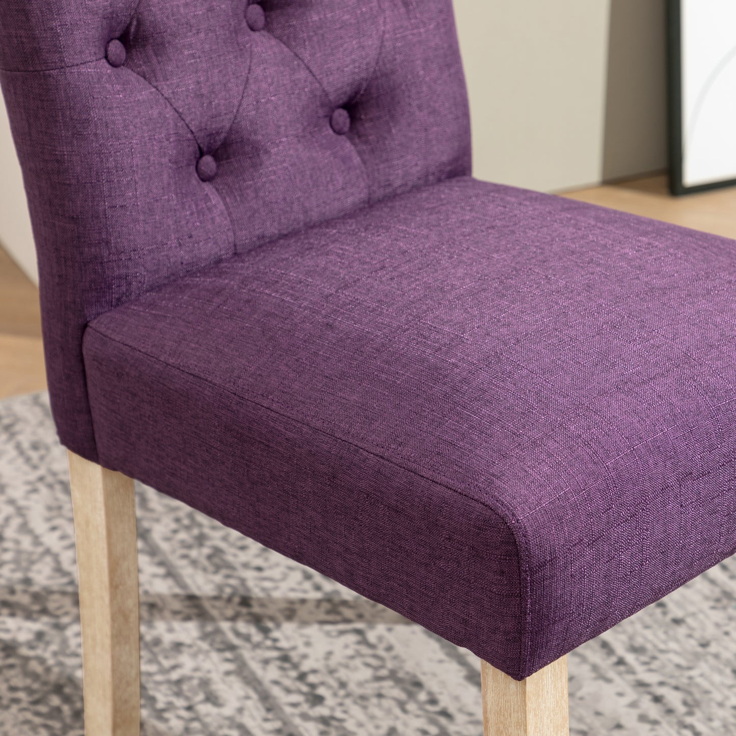 Tufted purple fabric dining chair with light wood legs