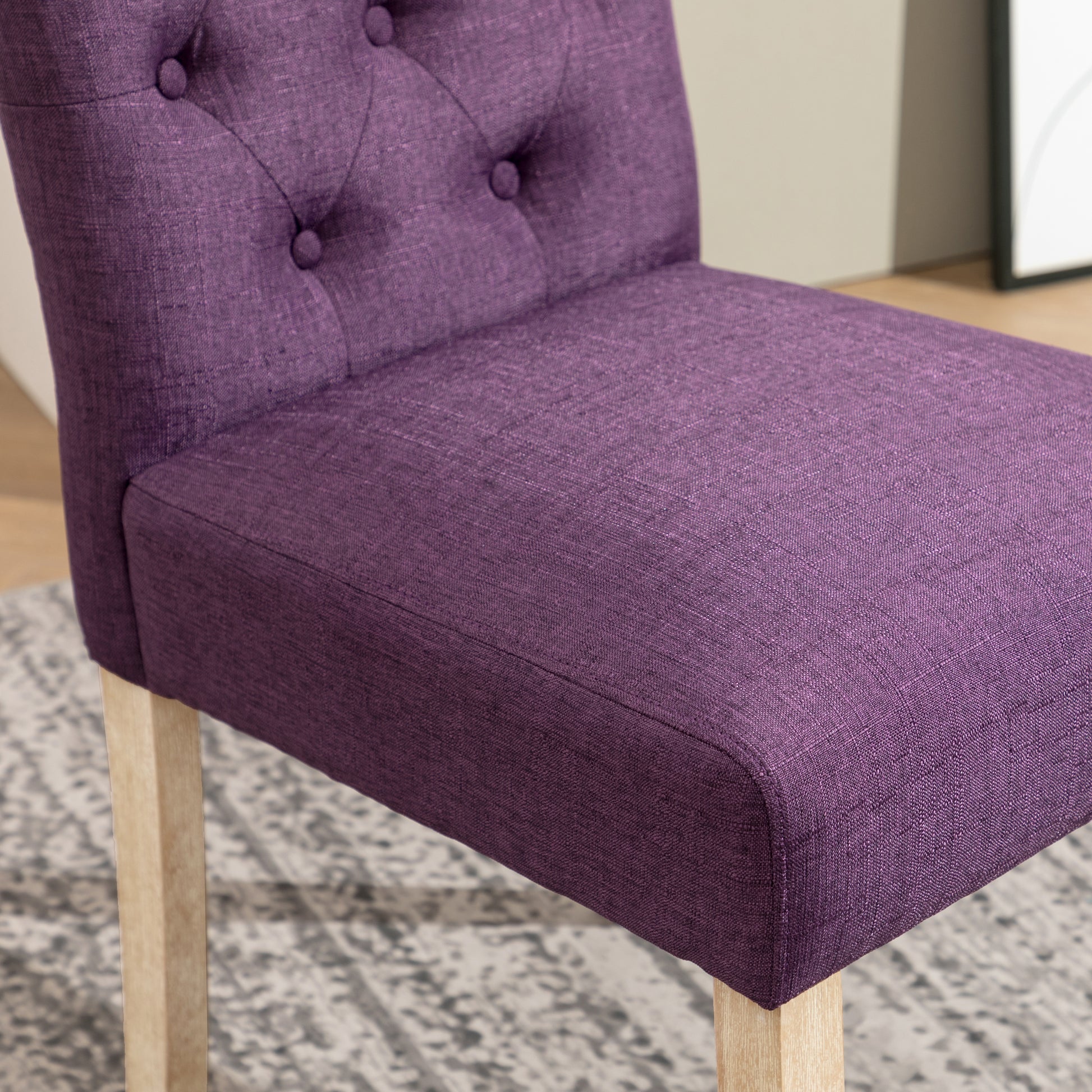 Tufted purple fabric dining chair with light wood legs