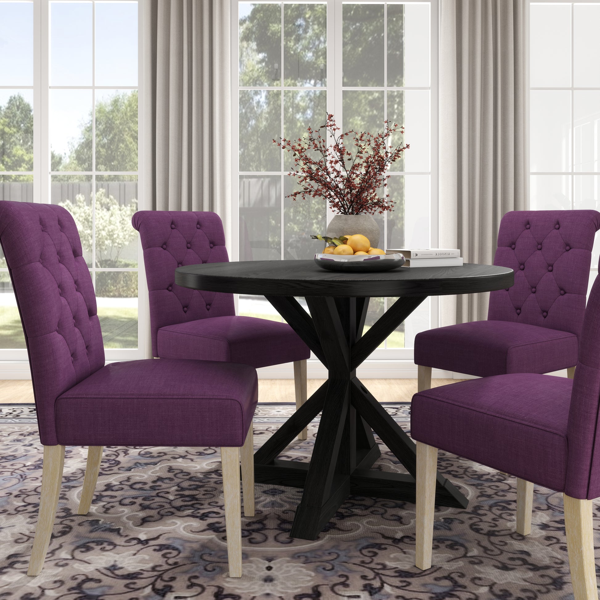 Tufted purple dining chairs surrounding a dark wood round table