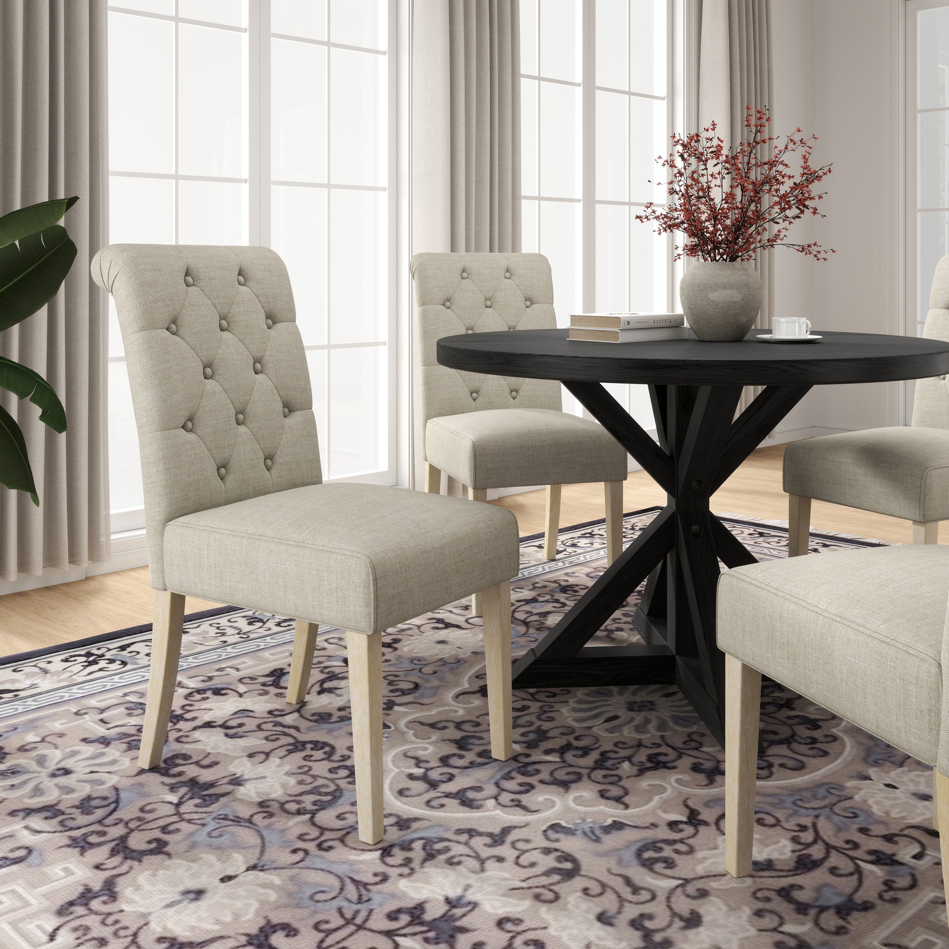 Tufted linen dining chair with light wood legs and scrollpatterned rug