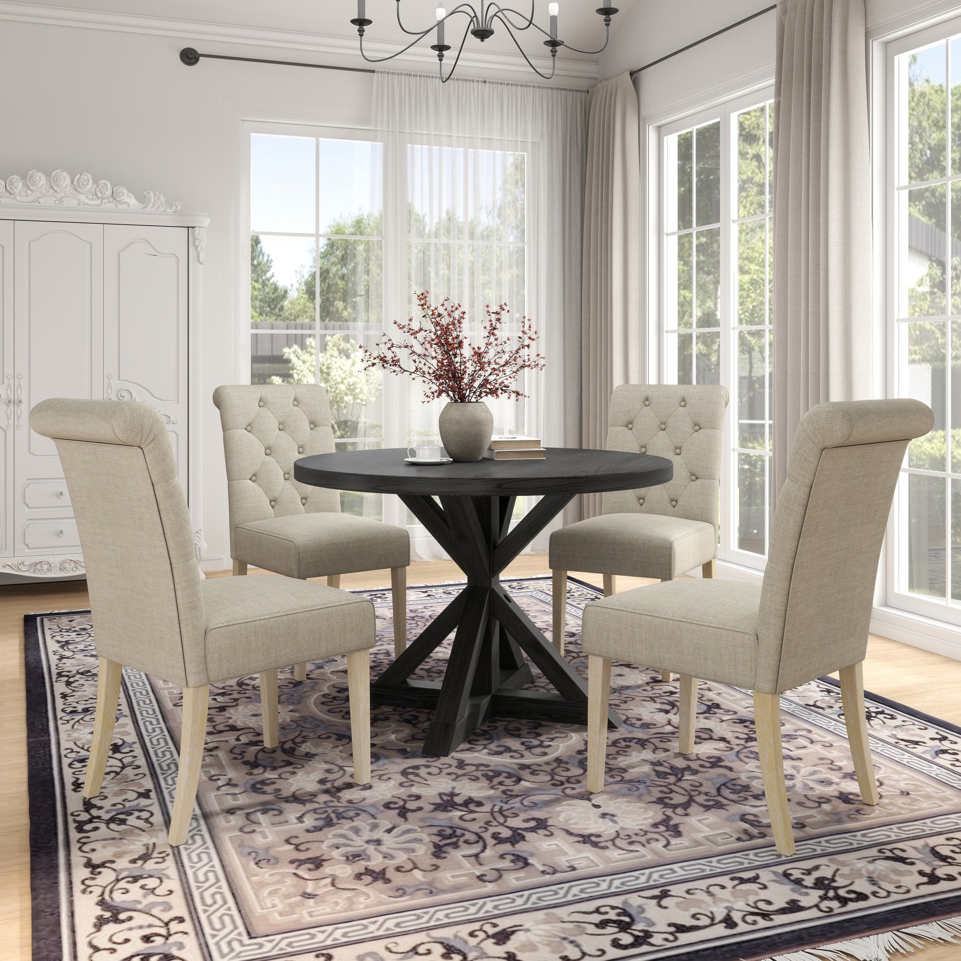 Tufted beige dining chairs with light wood legs around a dark round dining table