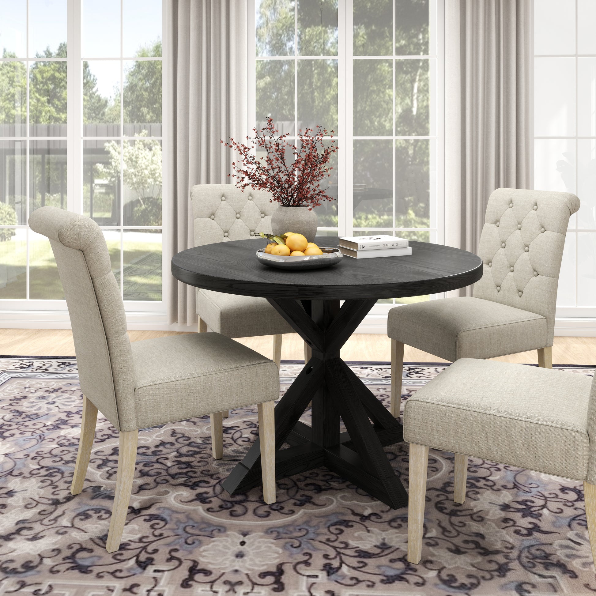 Round black dining table with tufted beige chairs