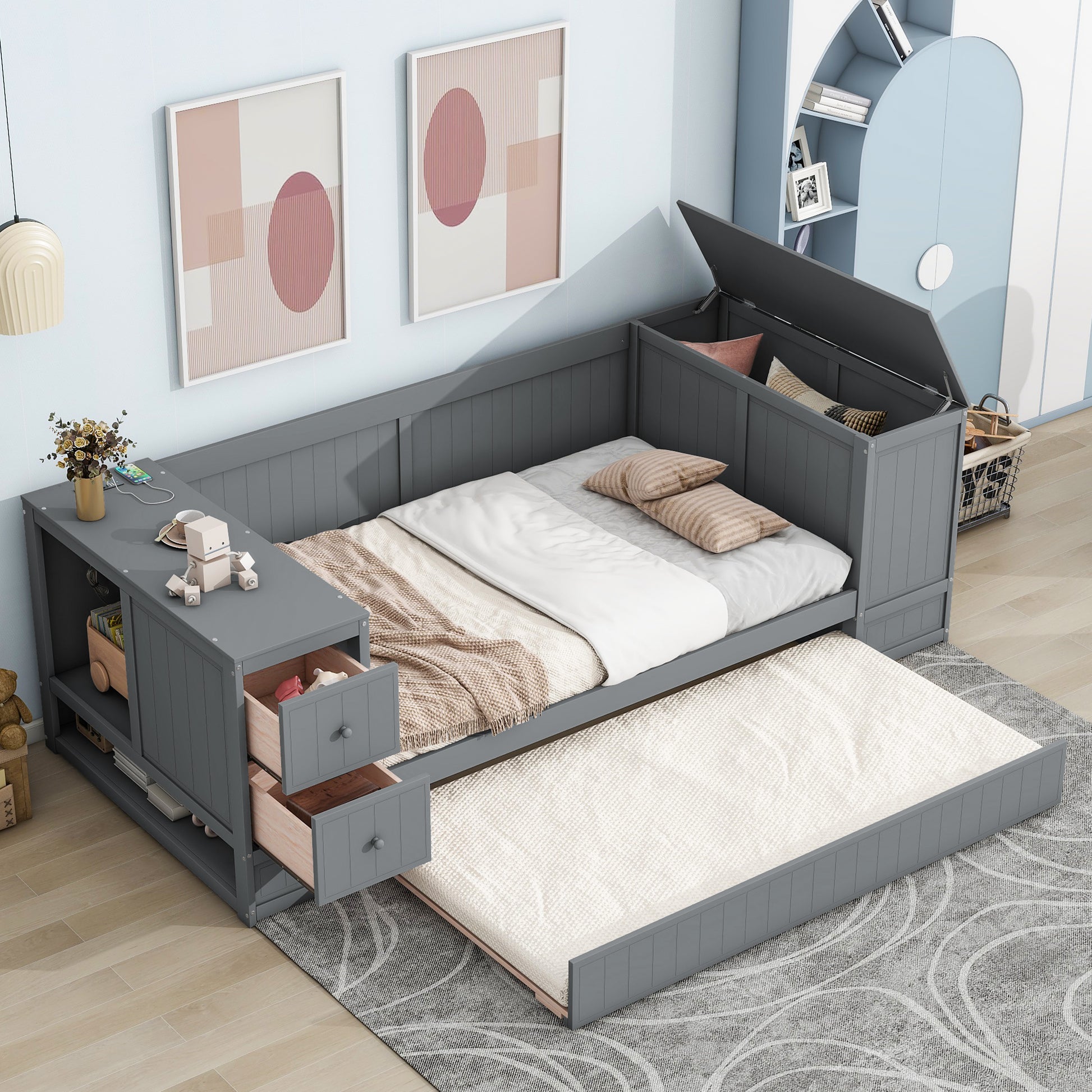 Gray upholstered daybed with a pullout trundle and storage drawers ideal for kids rooms