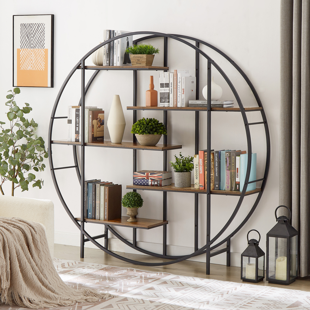 Round metal bookshelf with staggered wood shelves displaying books and decor