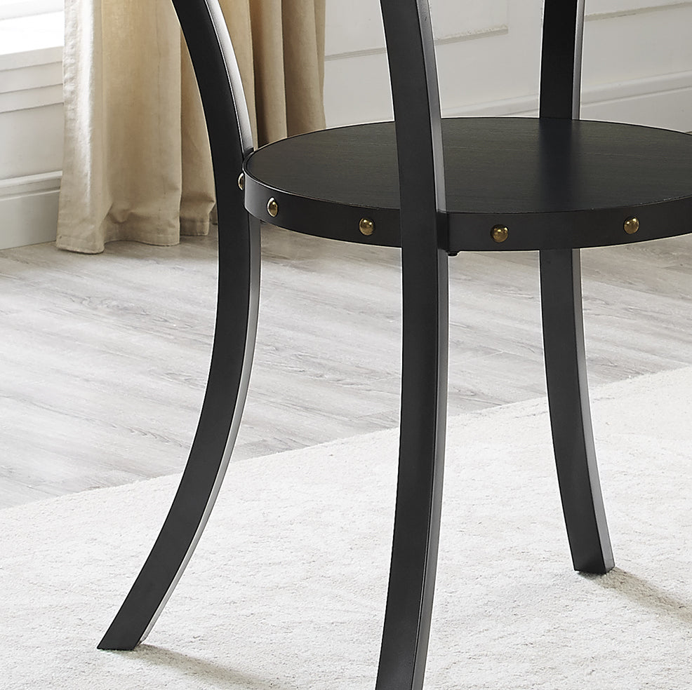 Black round accent table with curved legs and brass nailhead trim