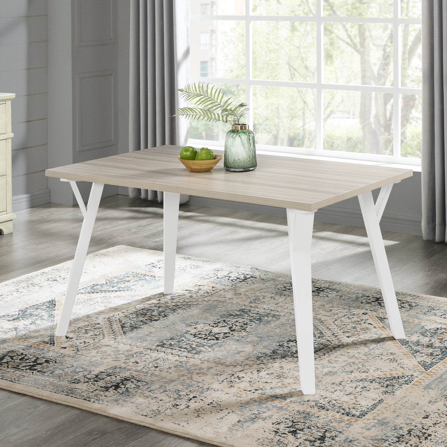 Light oak dining table with white angled legs perfect for modern kitchens