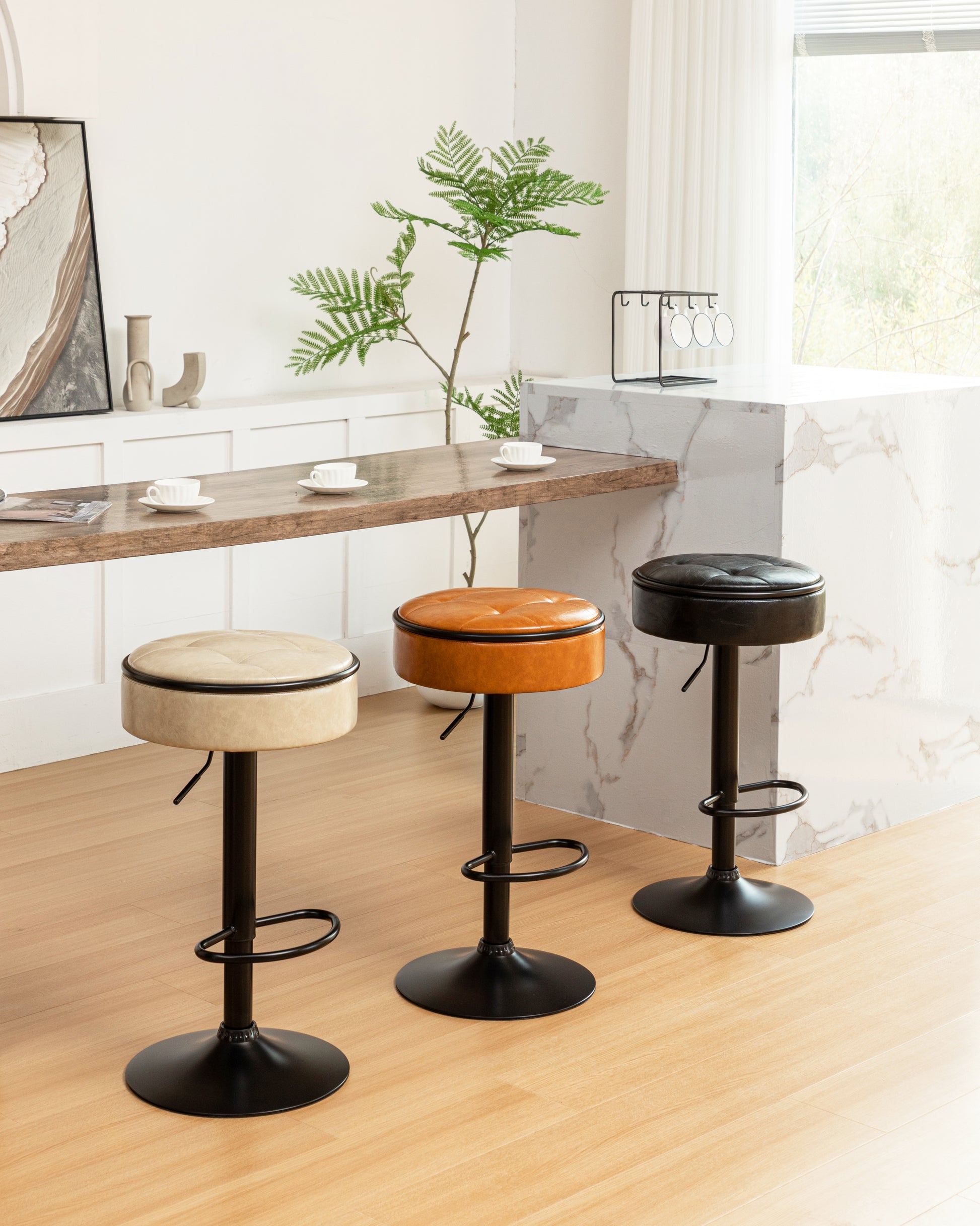 Tufted beige leatherette bar stool with black metal base and footrest