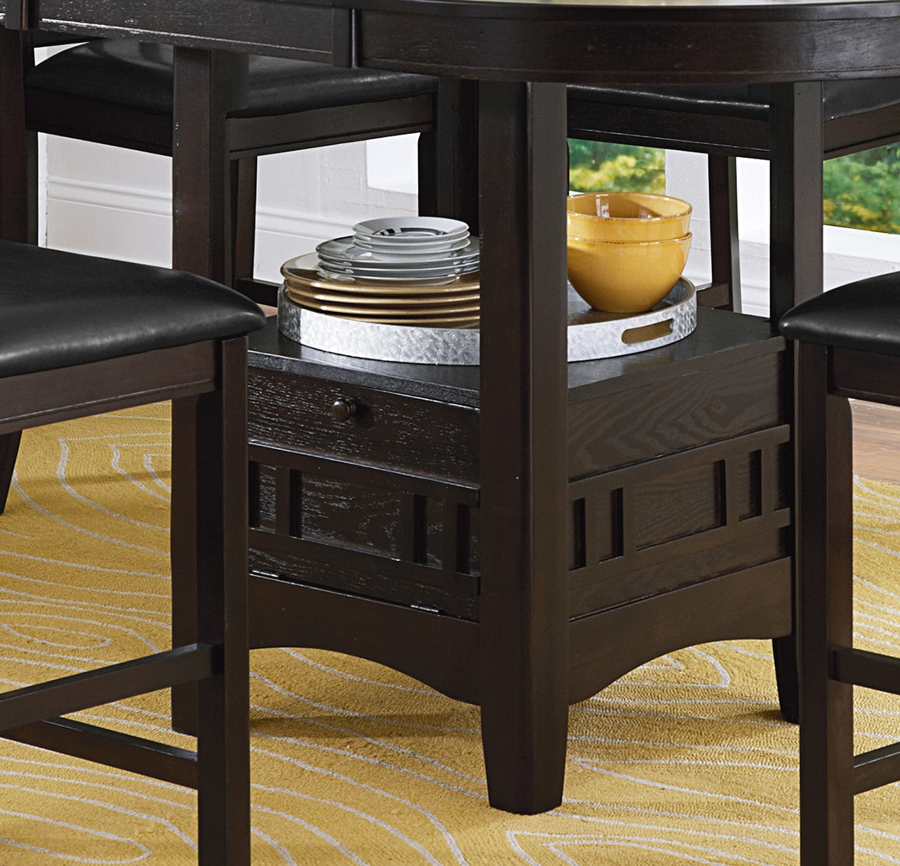Dark wood bar stool with black faux leather seat