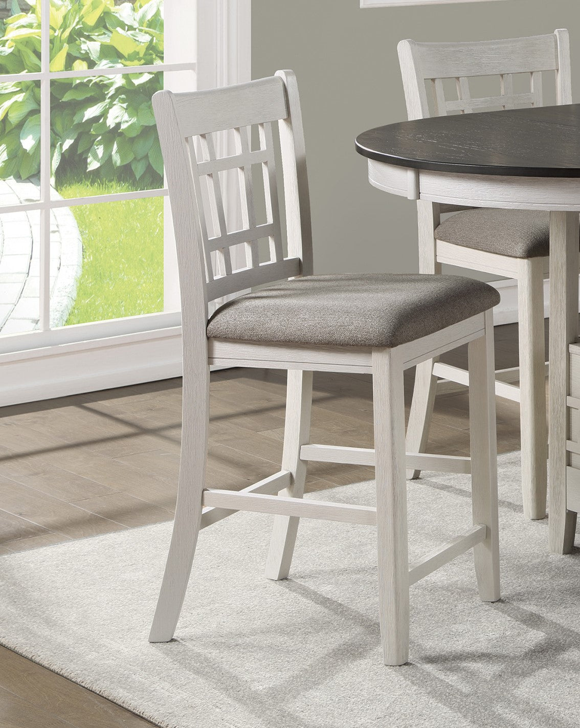 White wood counter stool with gray upholstered seat and geometric back