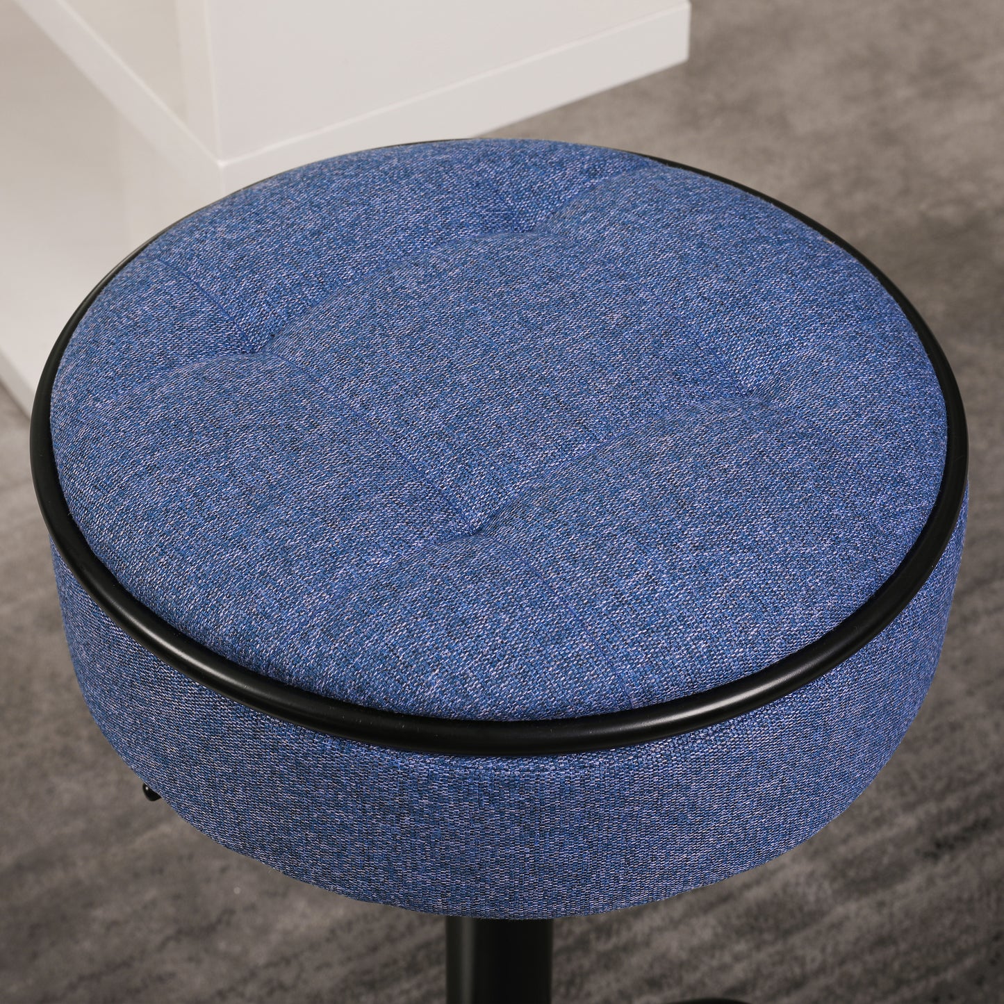 Round blue fabric stool with black trim