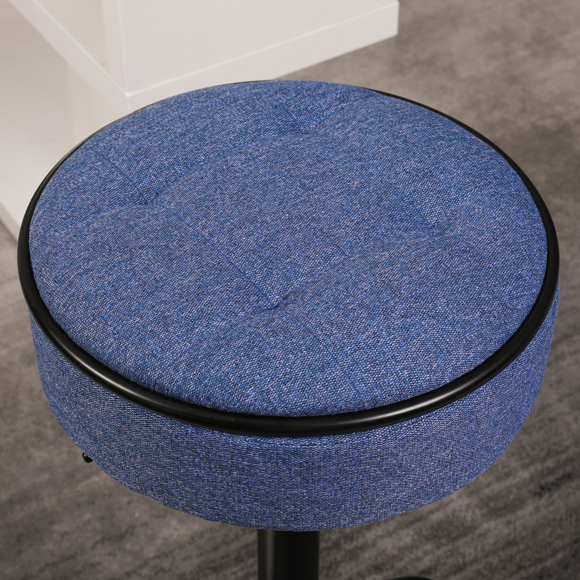 Round blue fabric stool with black trim