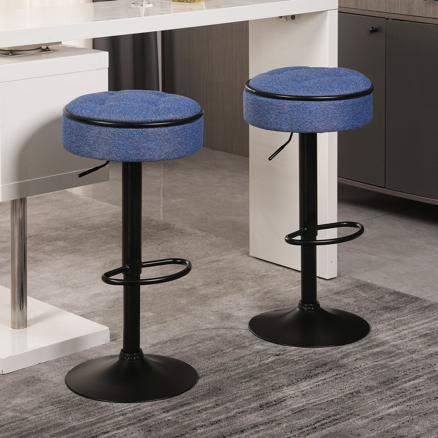 Blue fabric adjustable height bar stool with black metal base and footrest