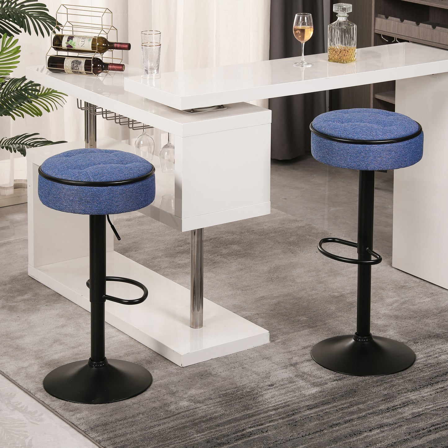 Blue upholstered bar stool with black metal base and footrest