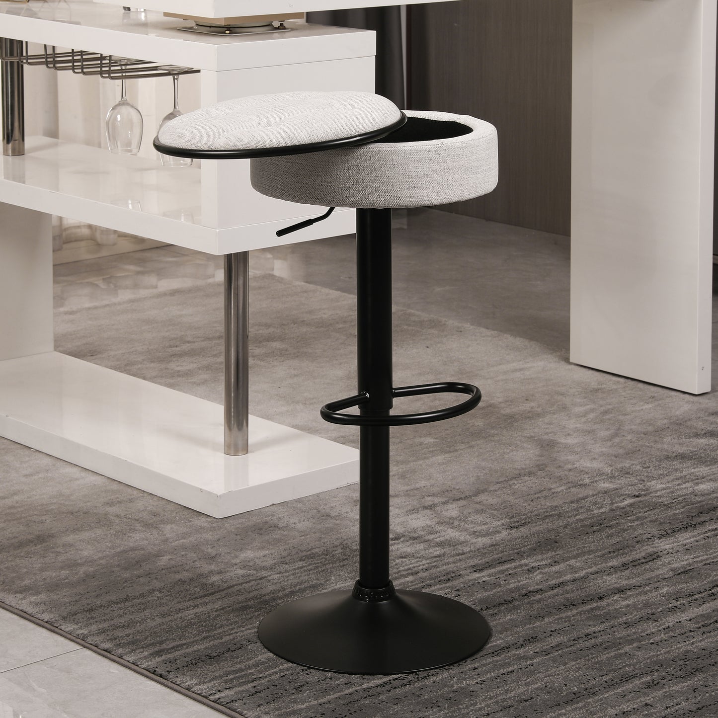 Adjustable height grey fabric bar stool with black base