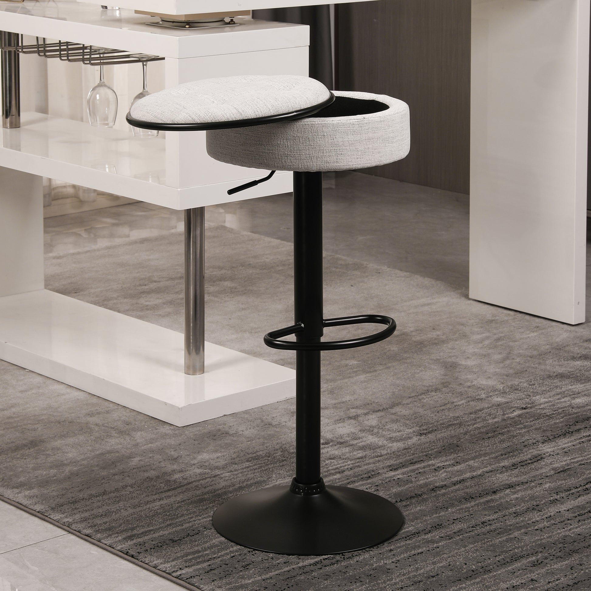 Adjustable height grey fabric bar stool with black base