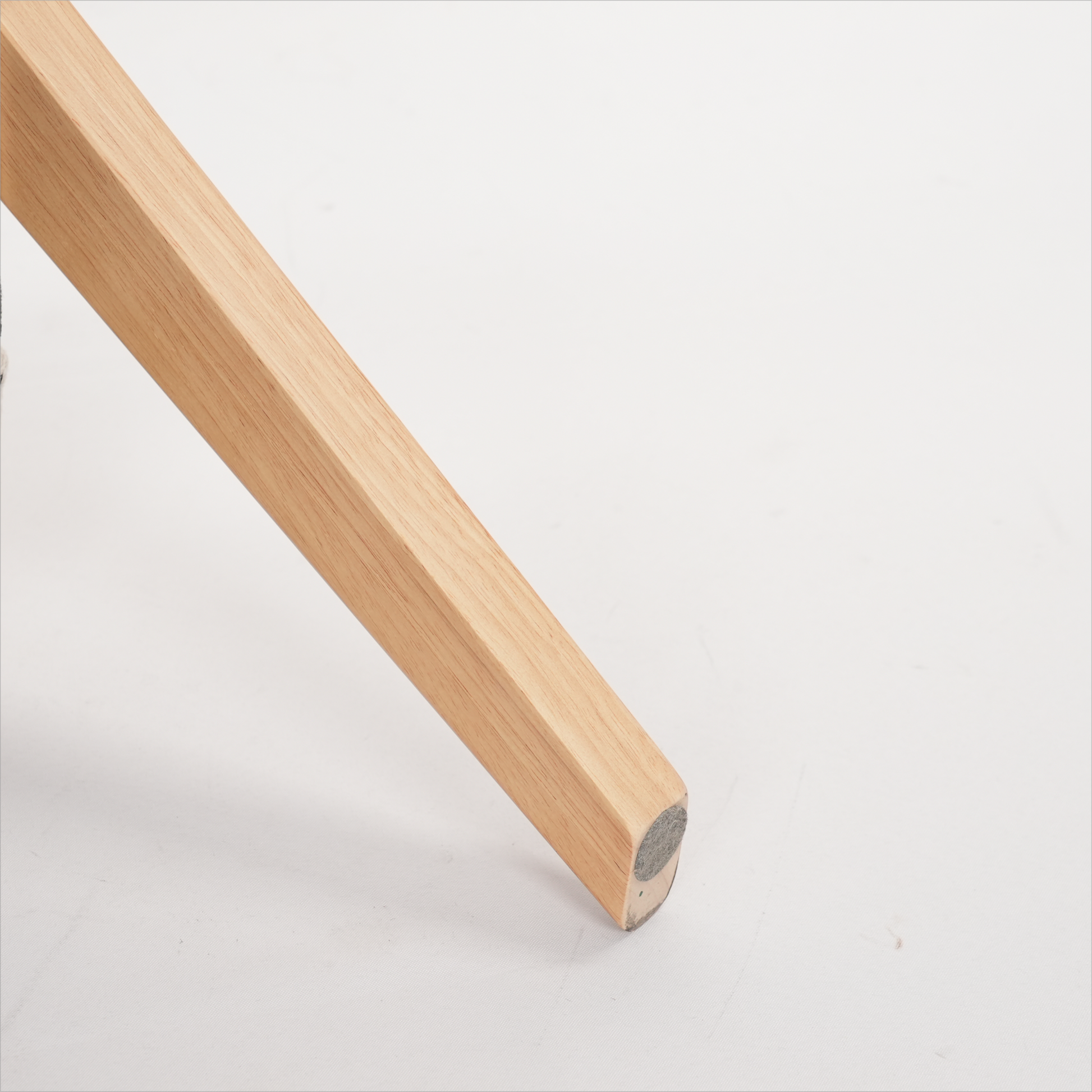 Natural oak wooden chair leg with felt floor protector