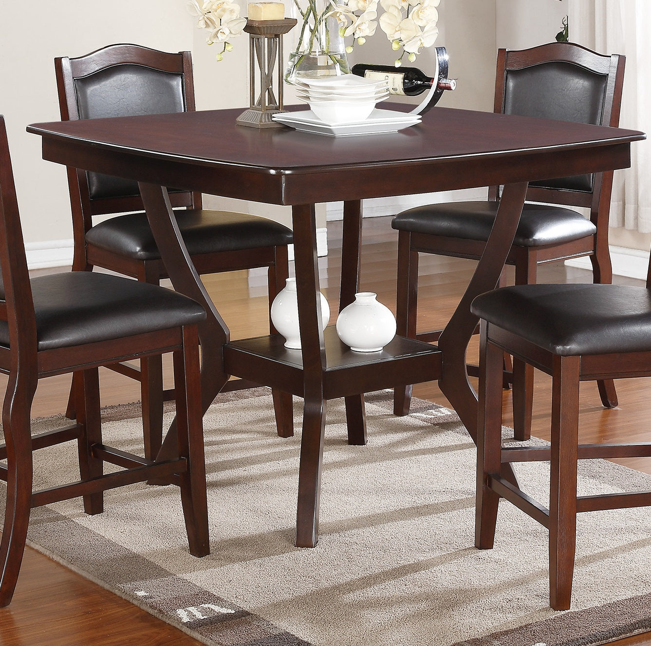 Dark wood counter height table and chairs with upholstered seats