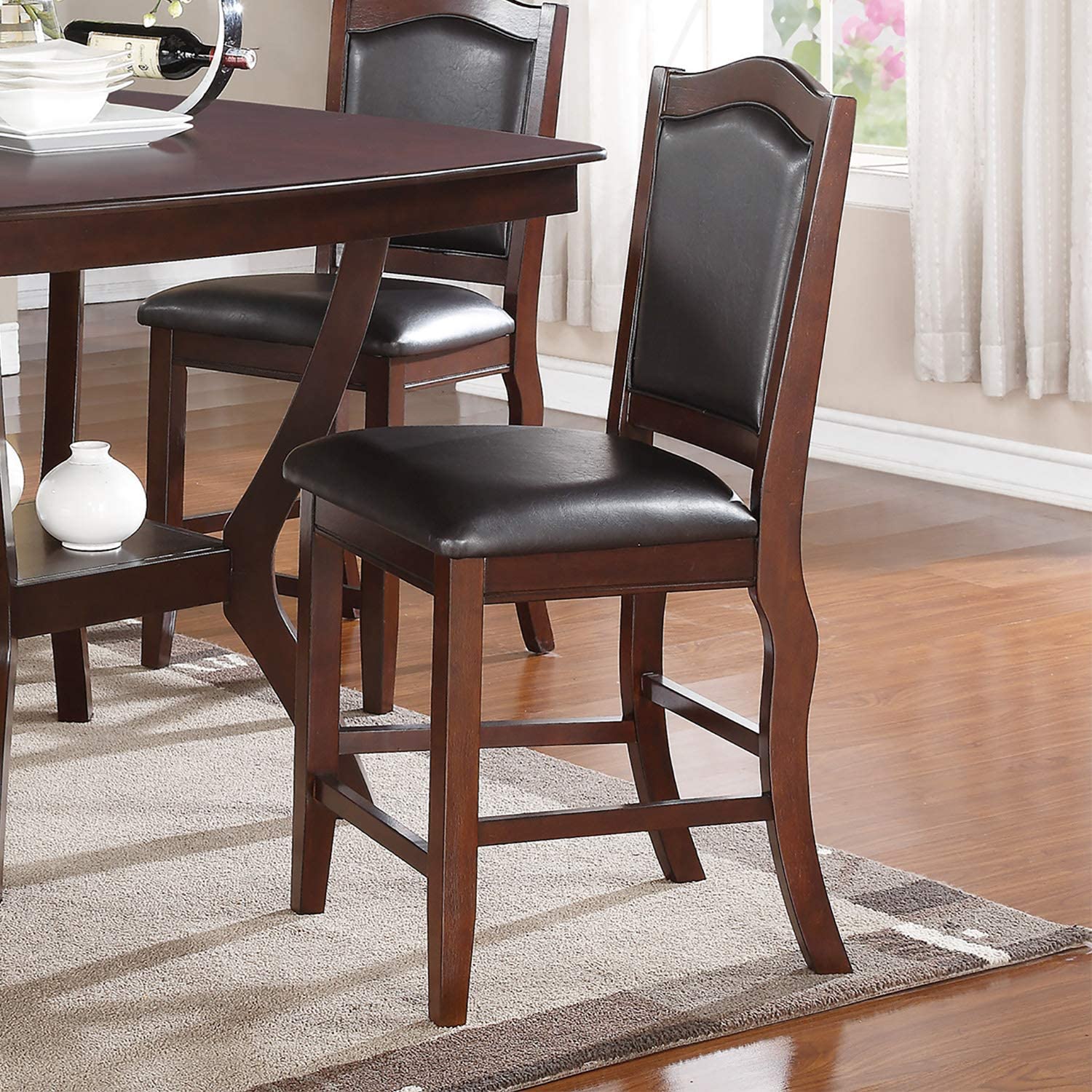 Dark brown leather upholstered counter height chair with curved back