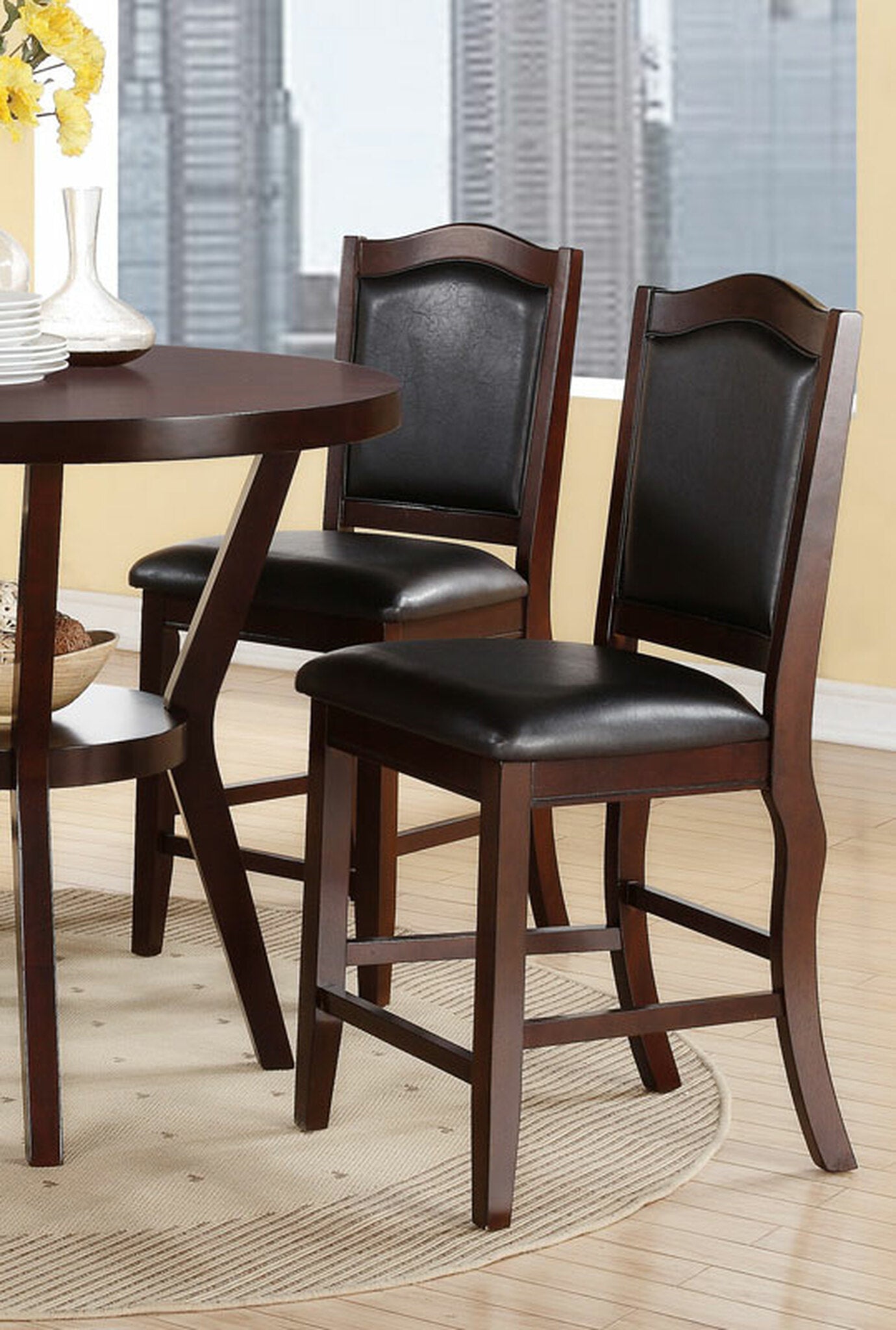 Dark brown wood and black faux leather counter stool with upholstered seat and back