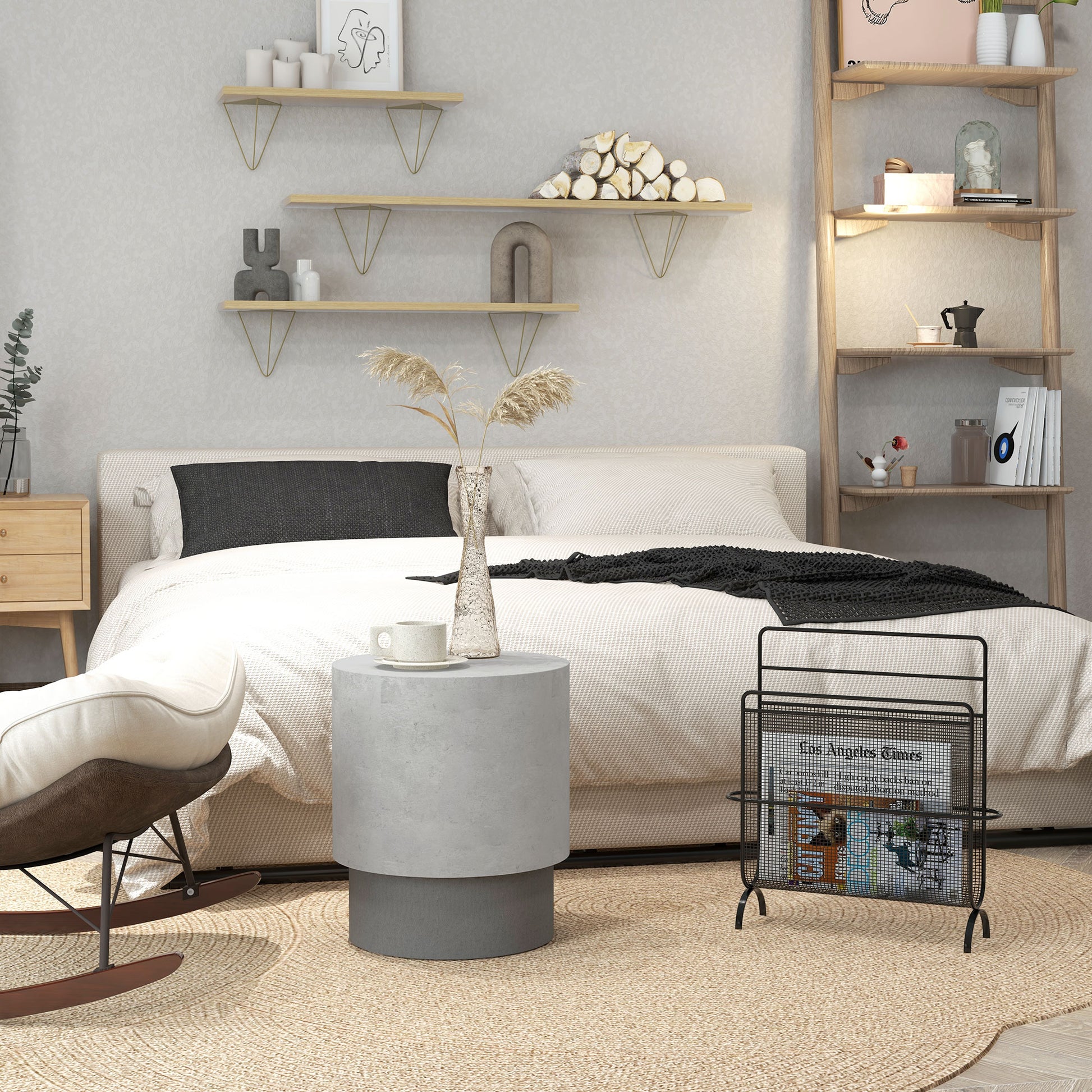 Modern gray concrete side table with a white mug and vase