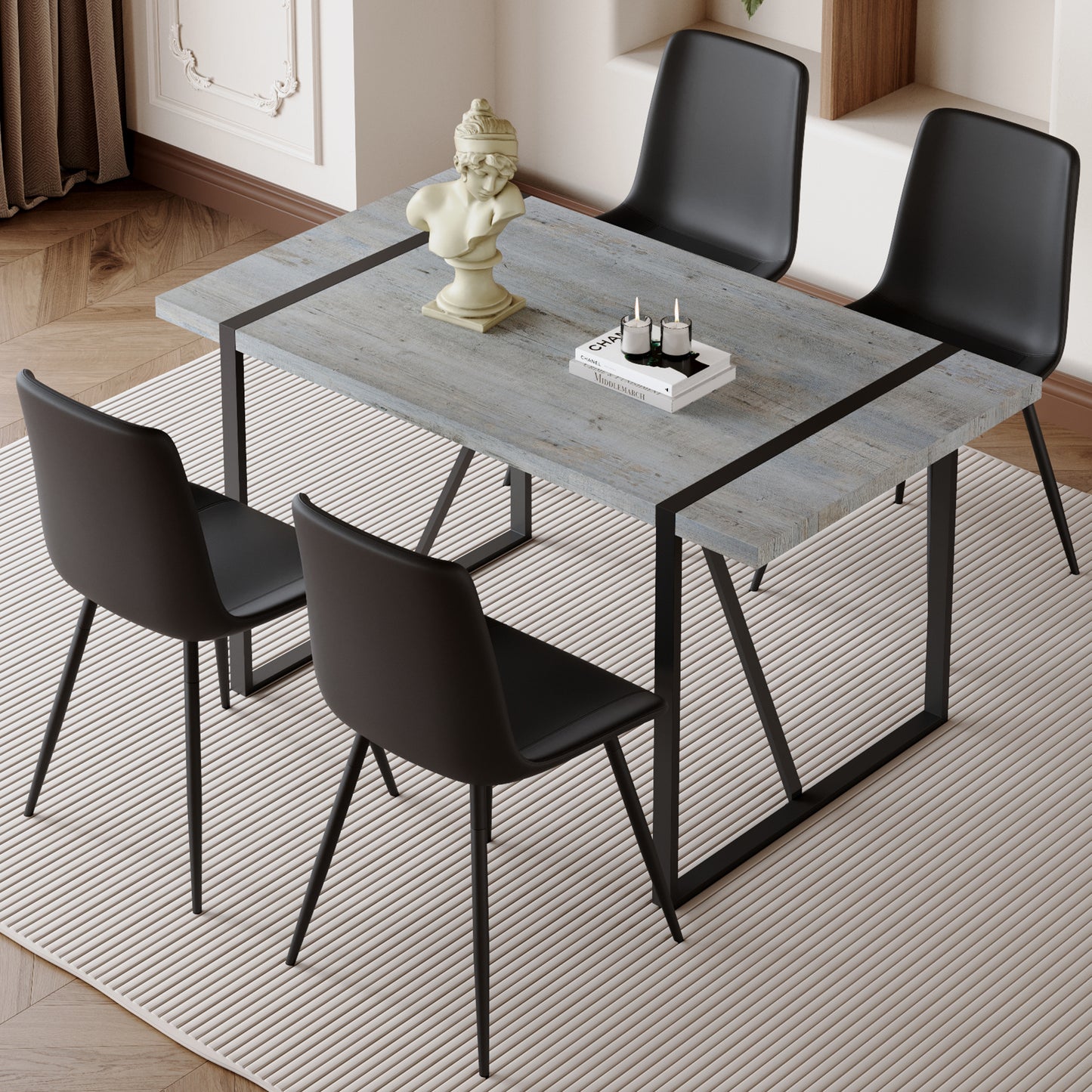 Gray wood dining table with black metal legs and chairs