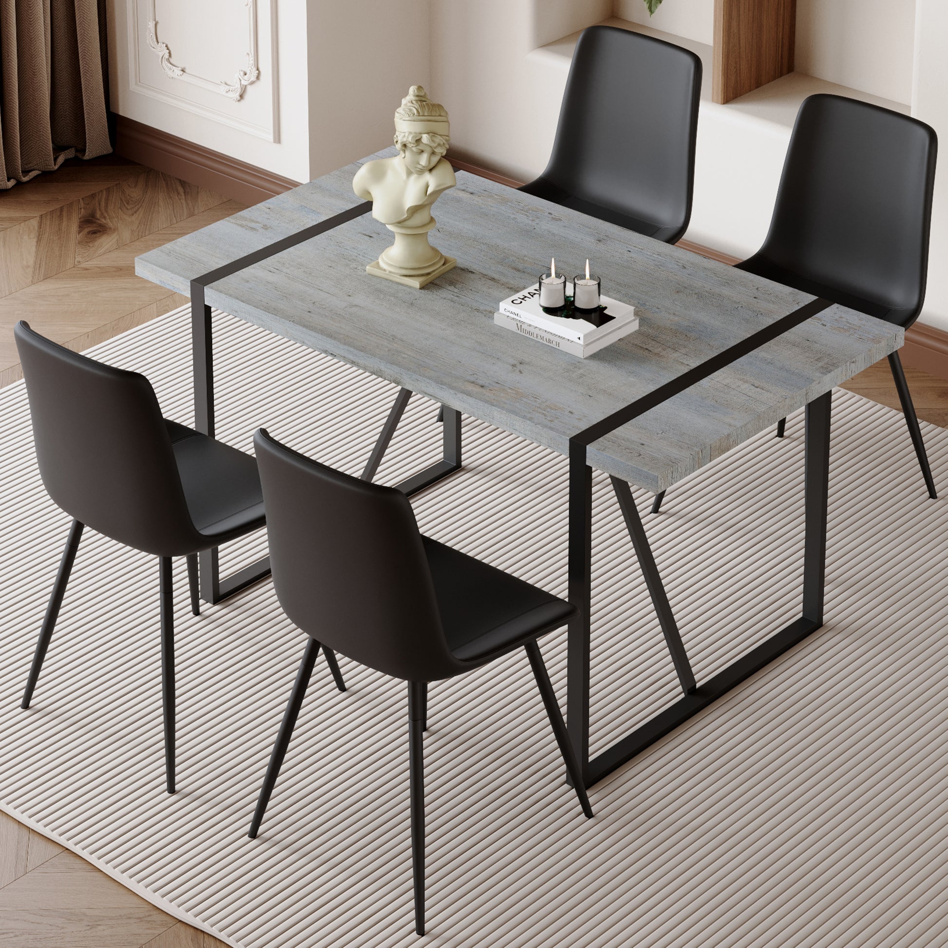 Gray wood dining table with black metal legs and chairs