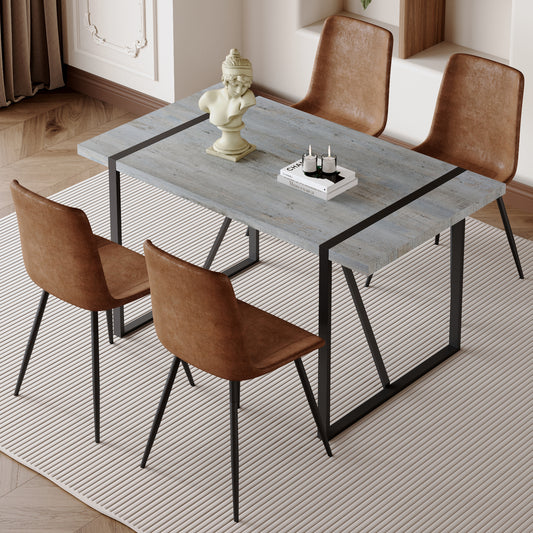 Rustic distressed wood dining table with black metal legs and seating for four