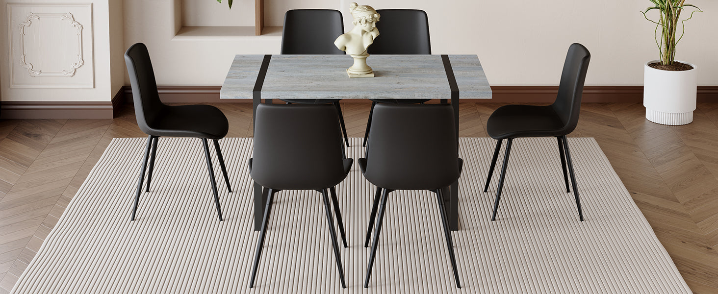 Modern black dining chairs around a light wood dining table