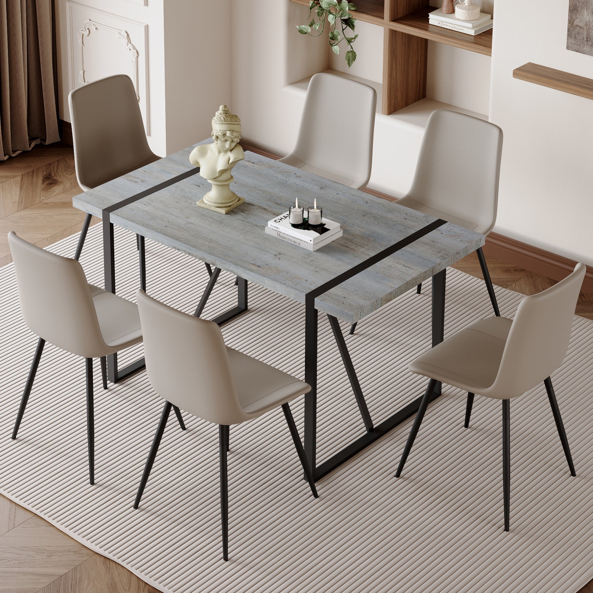 Rustic grey wood dining table with black metal legs and six beige chairs