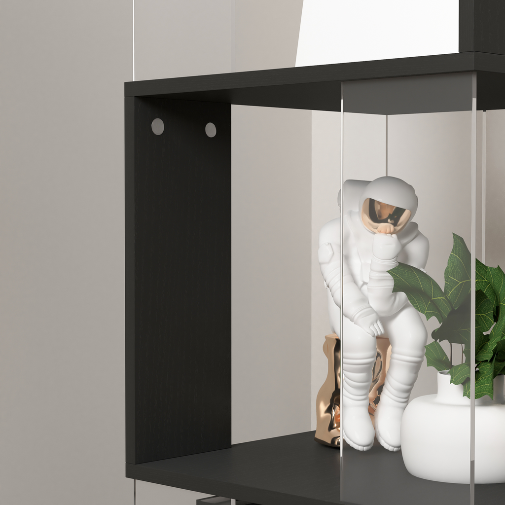 White astronaut statue with gold accents on a shelf
