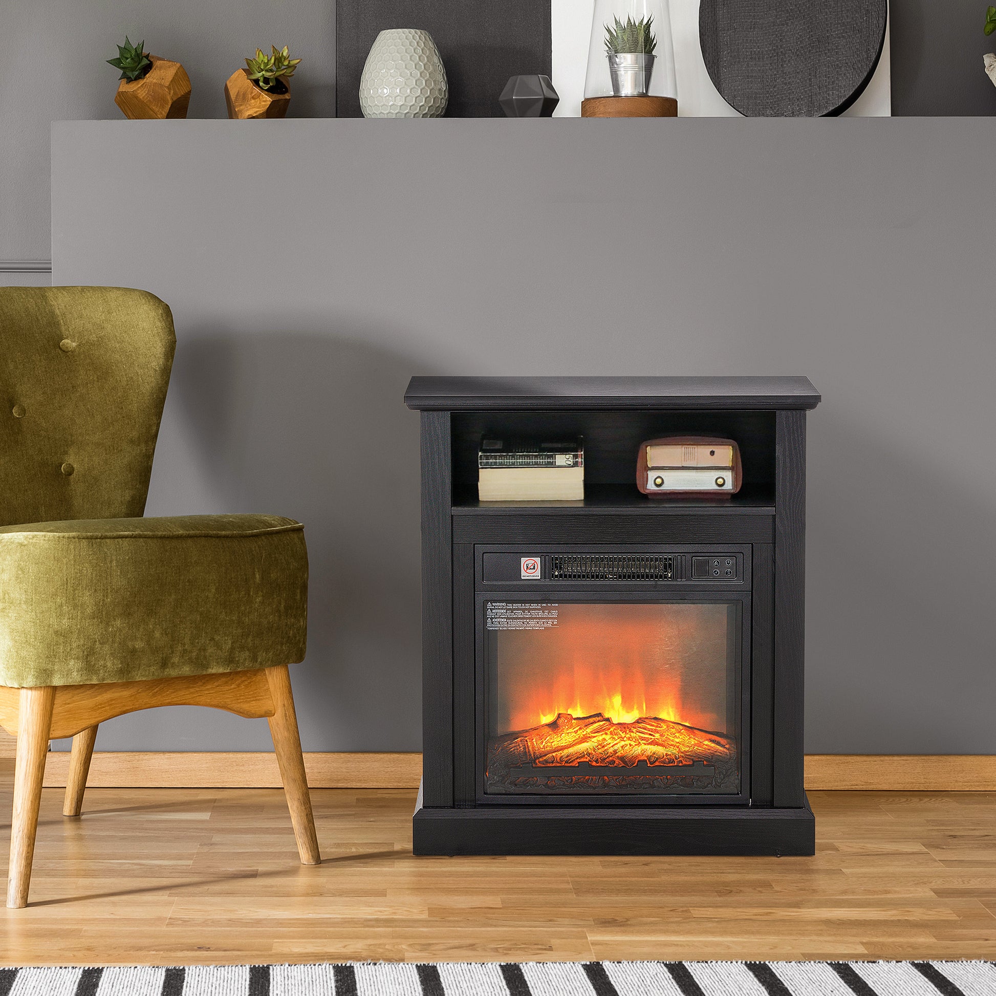 Black electric fireplace with realistic flame effect and storage shelf