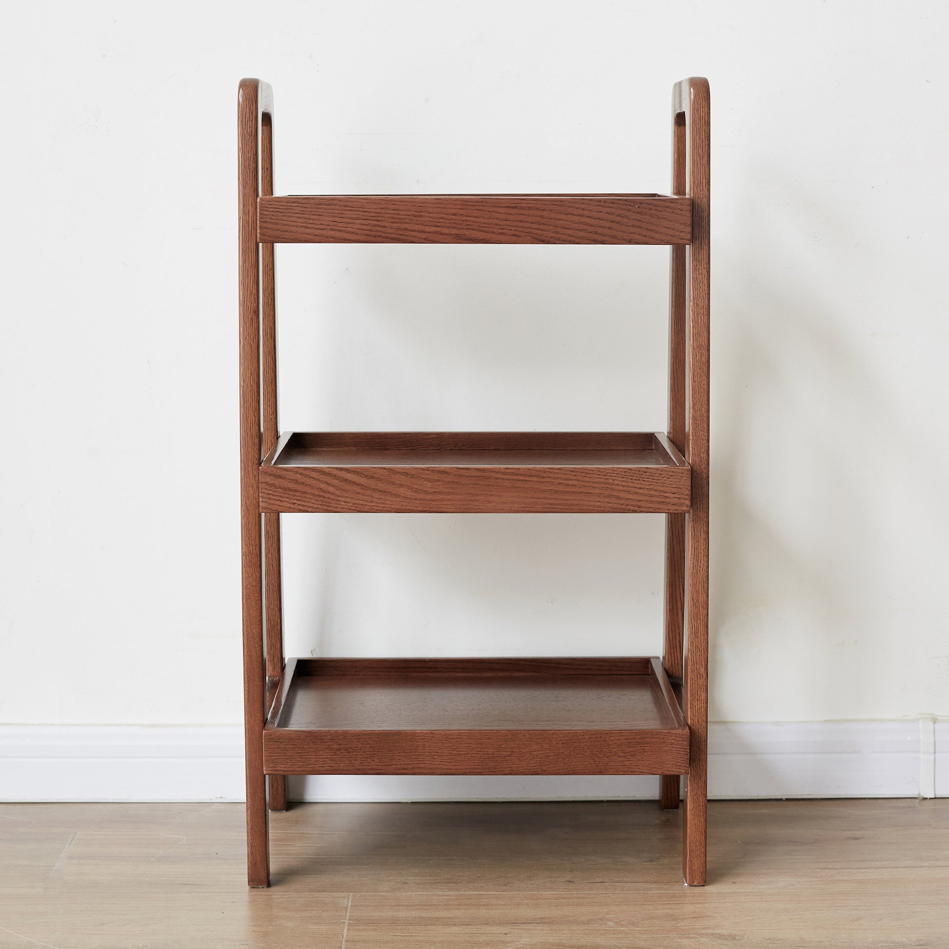 Dark brown wooden tiered shelf with a modern ladder design