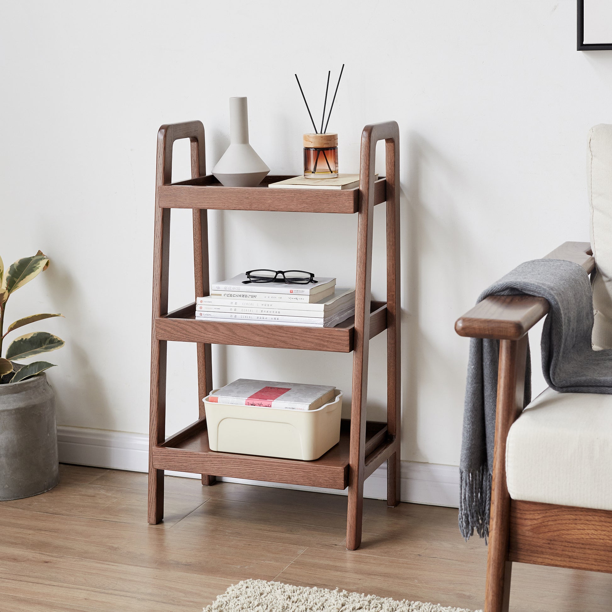 Wooden ladder shelf with books and decor