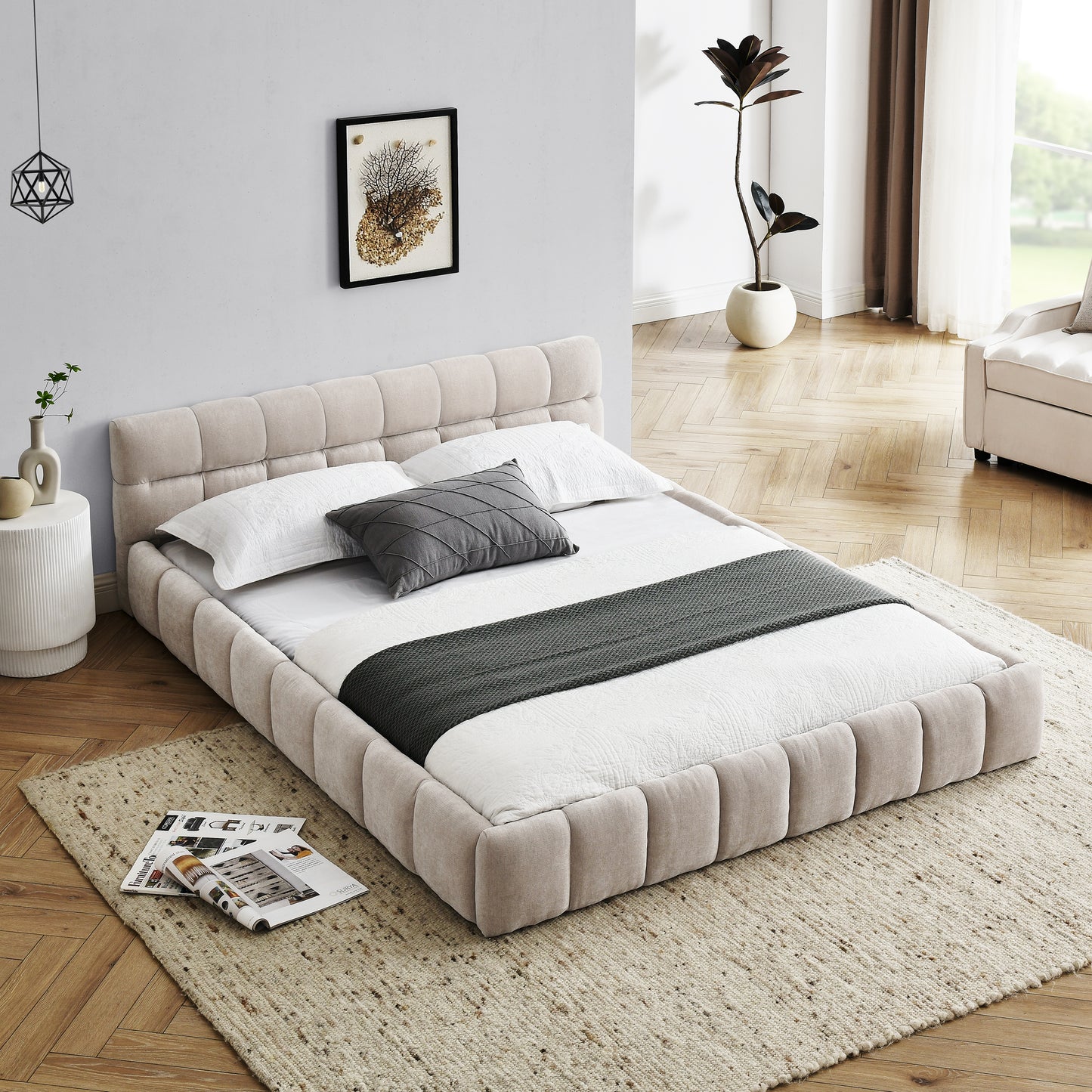 Beige upholstered platform bed with tufted headboard and white linens