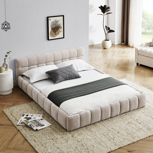 Beige upholstered platform bed with tufted headboard and white linens