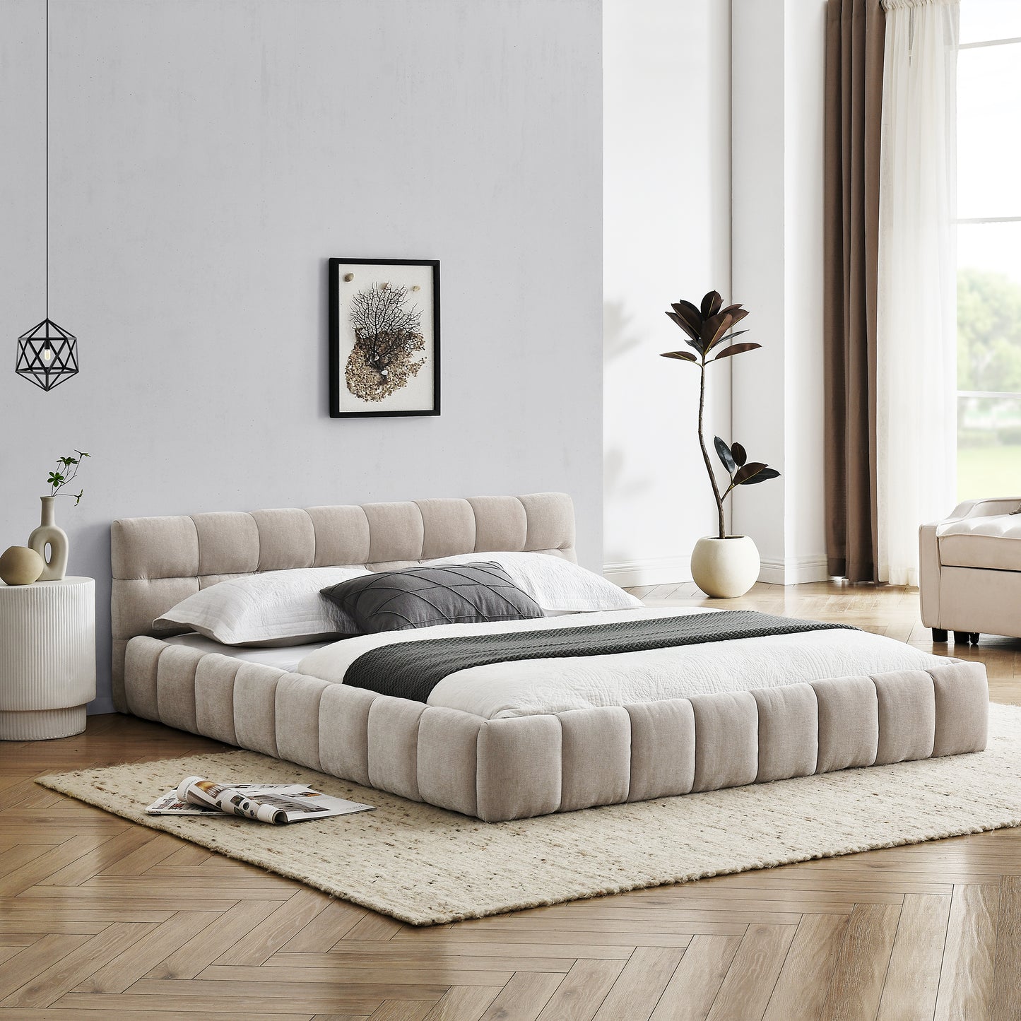 Upholstered beige platform bed with padded headboard and bedding
