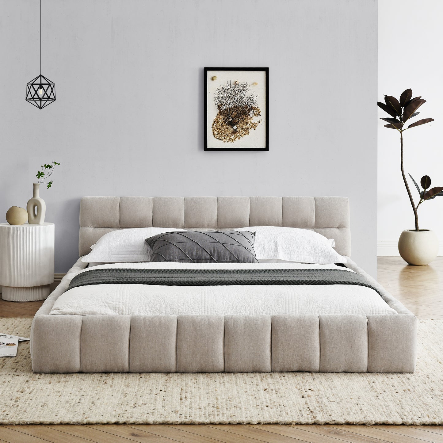 Upholstered platform bed in beige fabric with quilted detailing and padded headboard