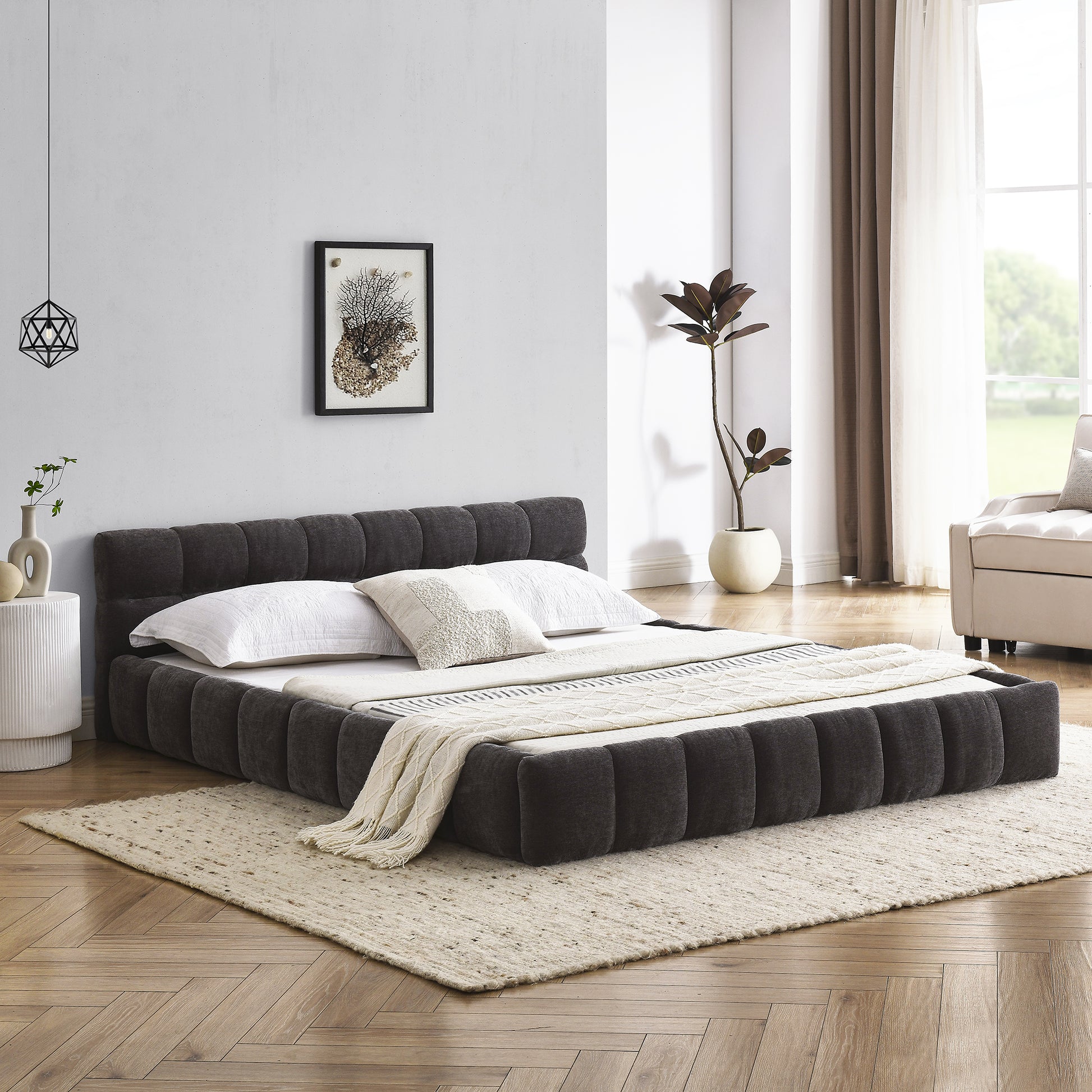 Dark gray upholstered king size bed with tufted headboard and footboard