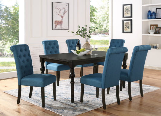 Tufted blue fabric dining chairs around dark wood table