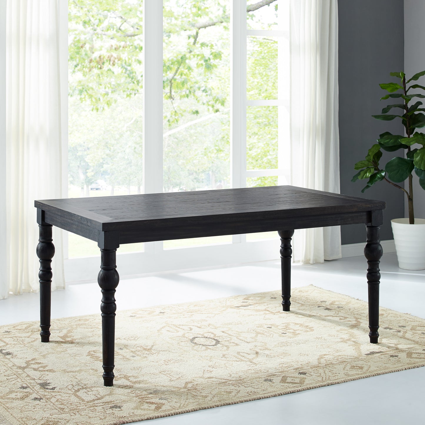 Dark wood dining table with turned legs