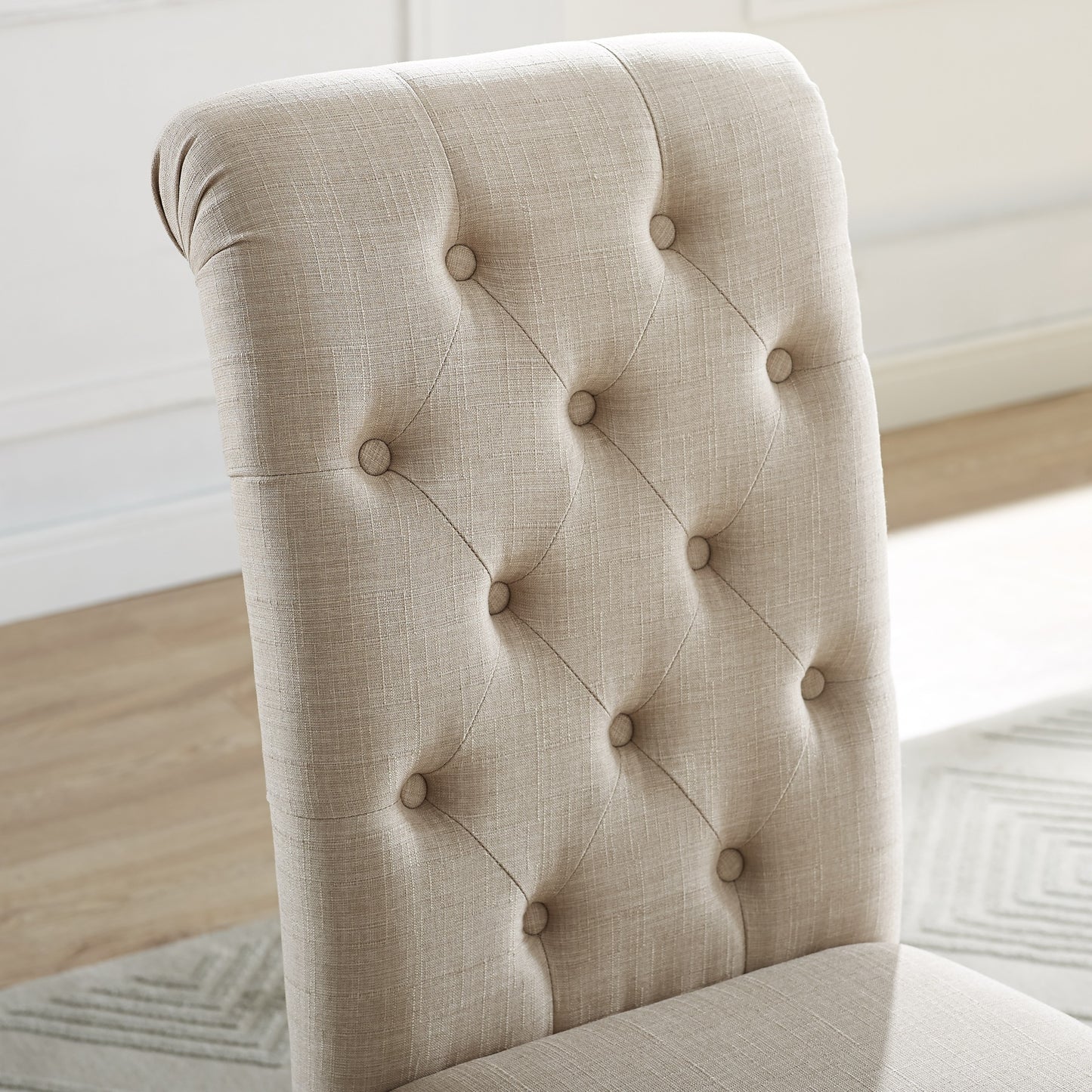 Tufted beige fabric dining chair back with button details