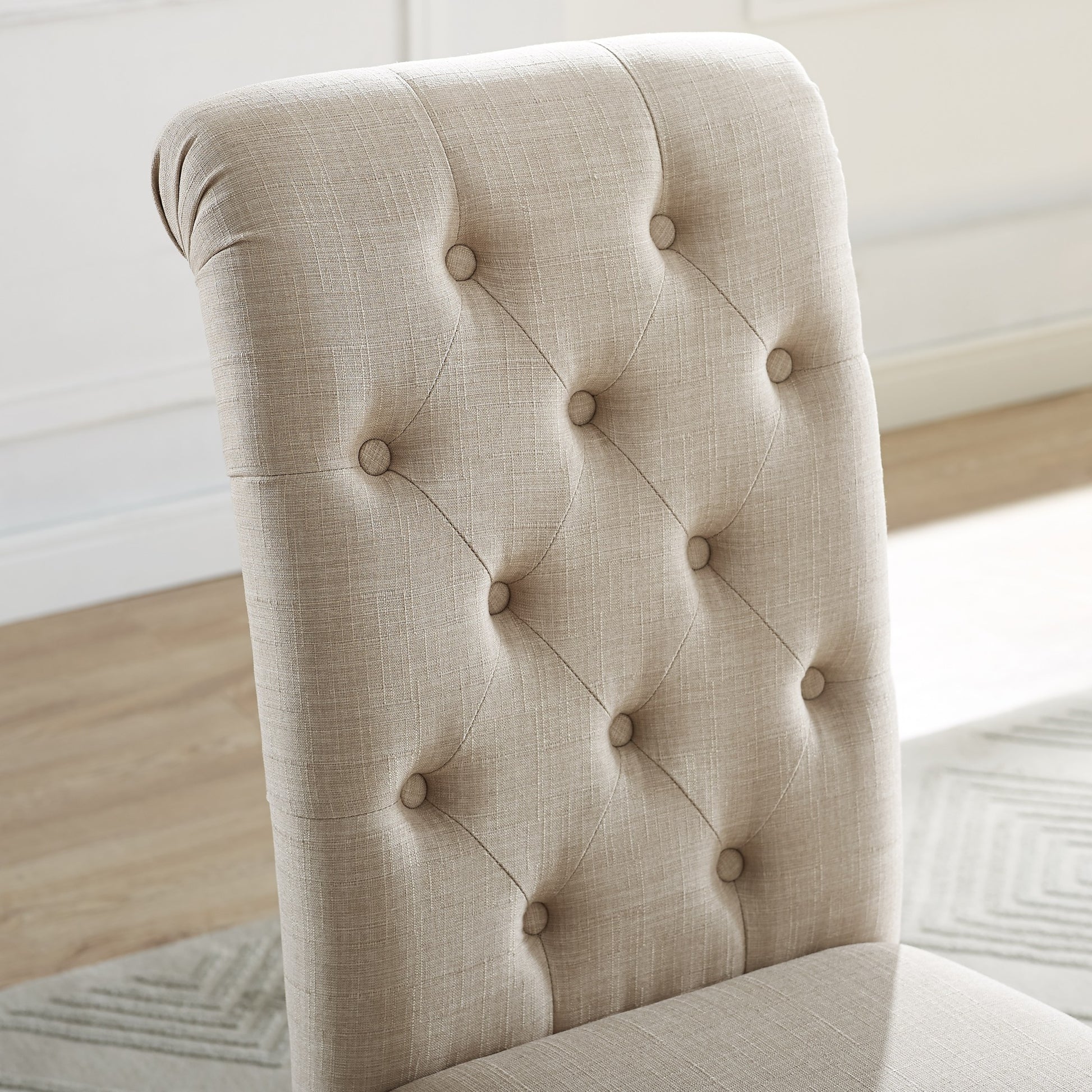 Tufted beige fabric dining chair back with button details