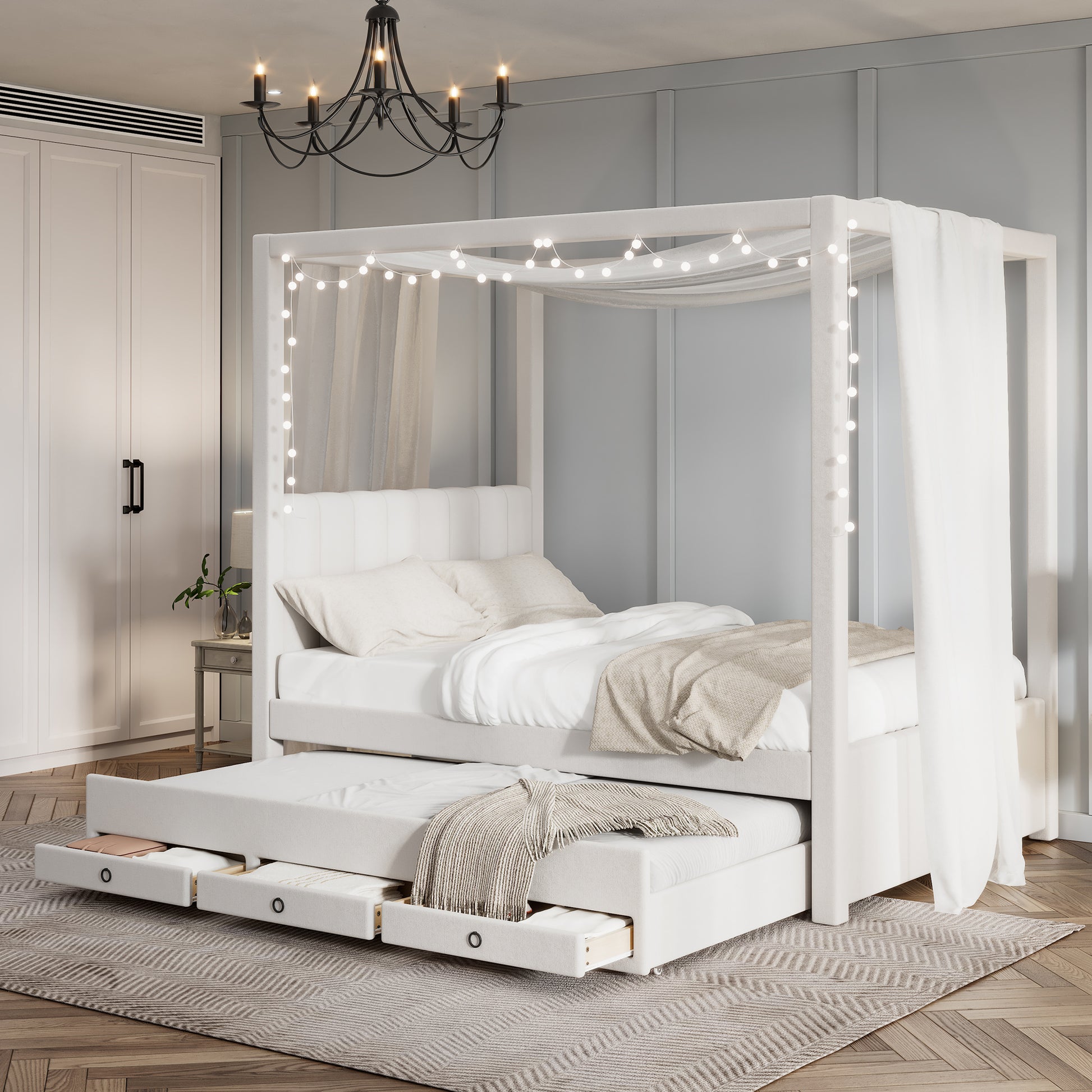 White upholstered canopy bed with pullout trundle and integrated storage drawers
