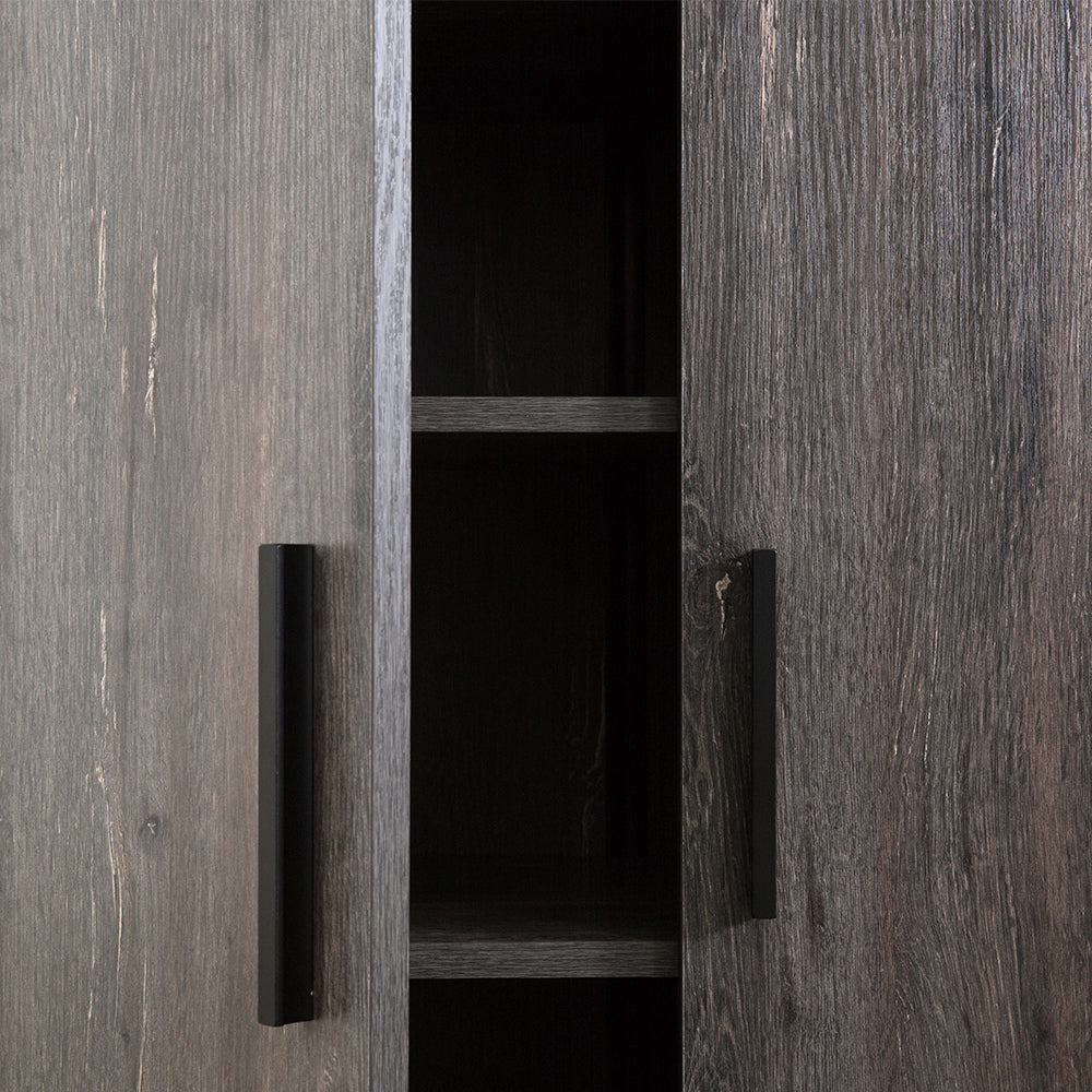 Closeup of dark gray wood grain cabinet doors with black handles