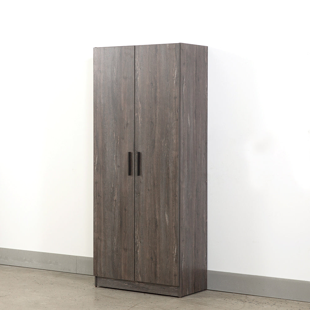 Tall dark wood wardrobe with double doors and black handles
