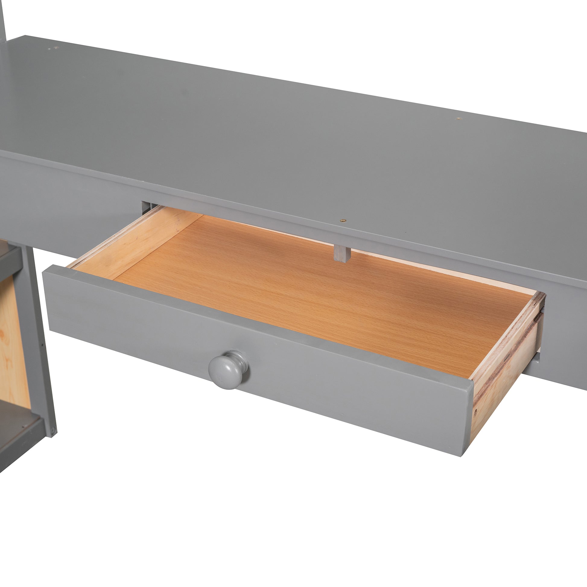 Gray desk with open drawer and wooden interior