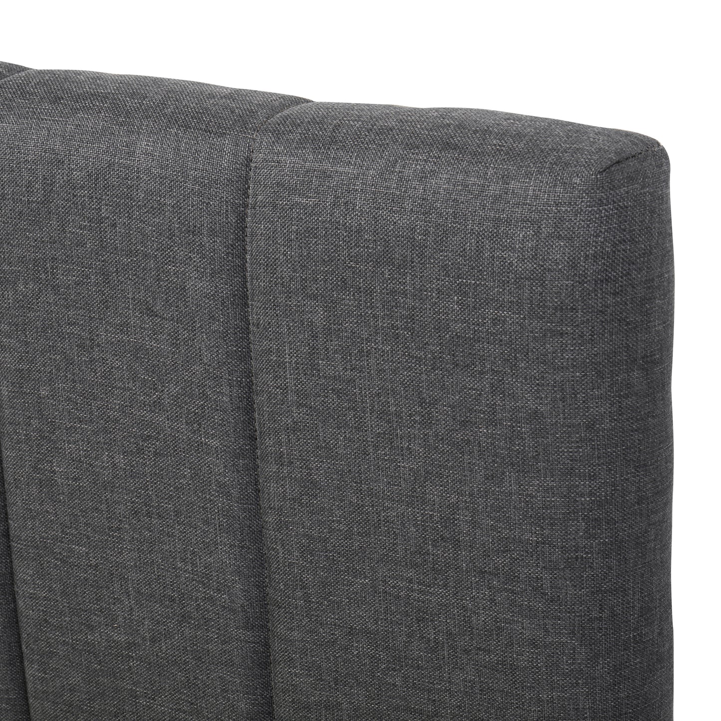 Closeup of dark grey linen tufted headboard fabric